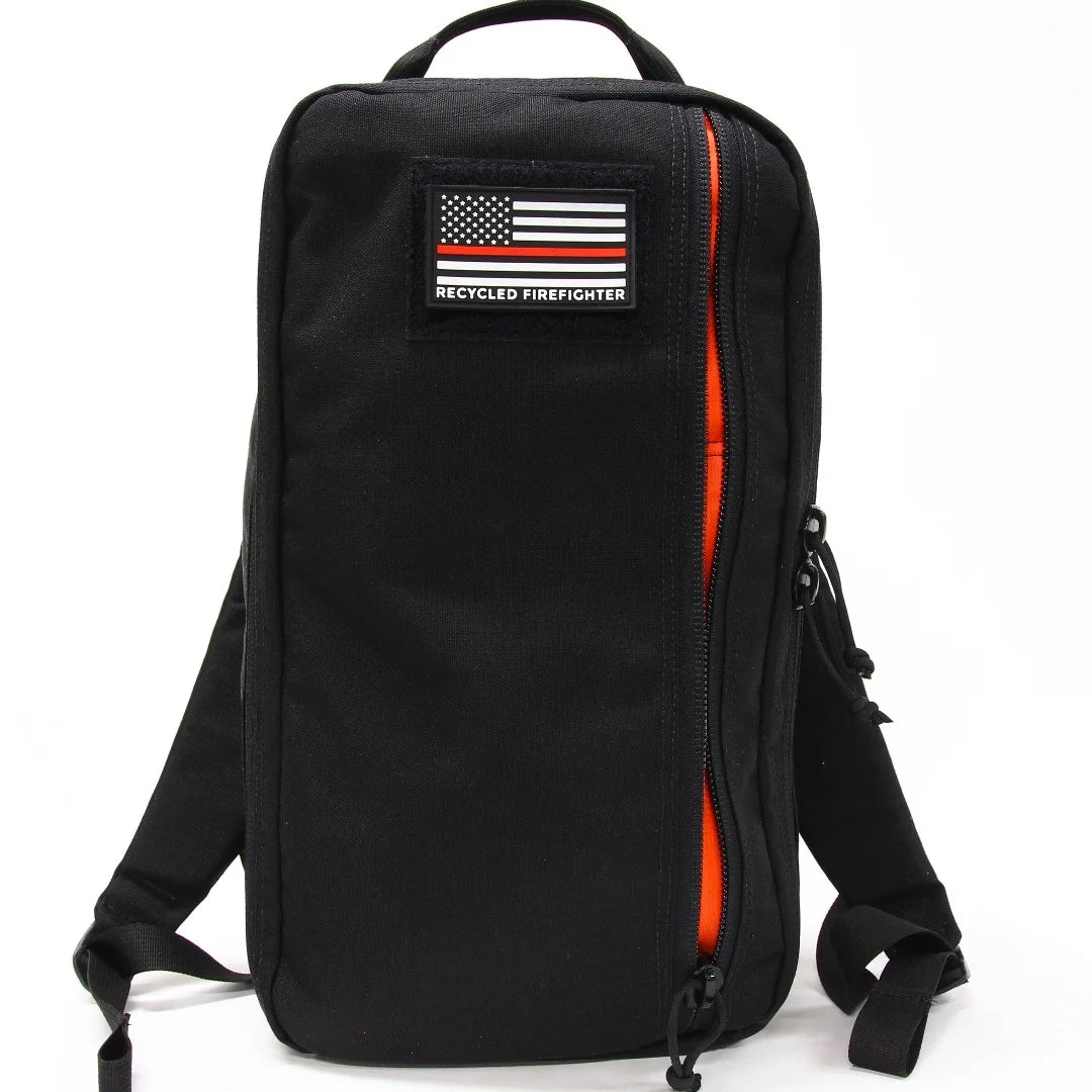 Tactical 12 Hour Backpack in 12 hr black orange inside by Recycled Firefighter. Quick-access pockets organize essentials efficiently.