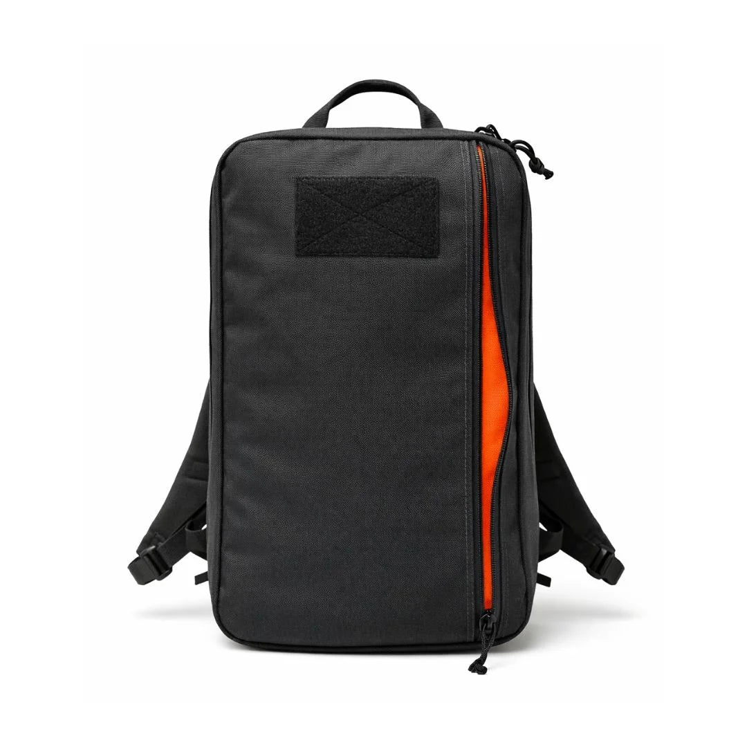 24 Hour tactical backpack in black orange inside by Recycled Firefighter. Spacious main compartment handles full-day mission requirements.