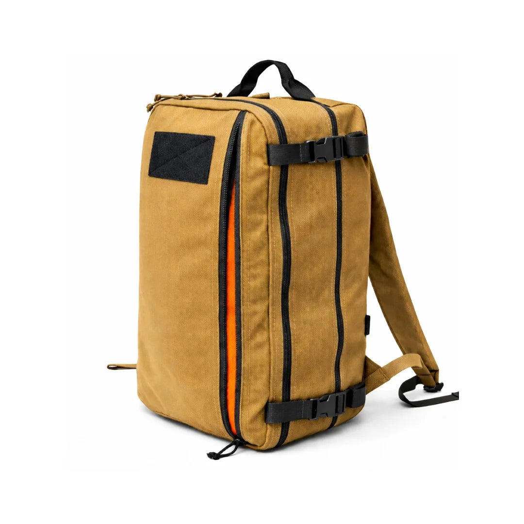 The Recycled Firefighter 24 Hour PLUS Backpack in Coyote brown offers a classic military-inspired aesthetic with a high-capacity 28-liter dual-clamshell design.