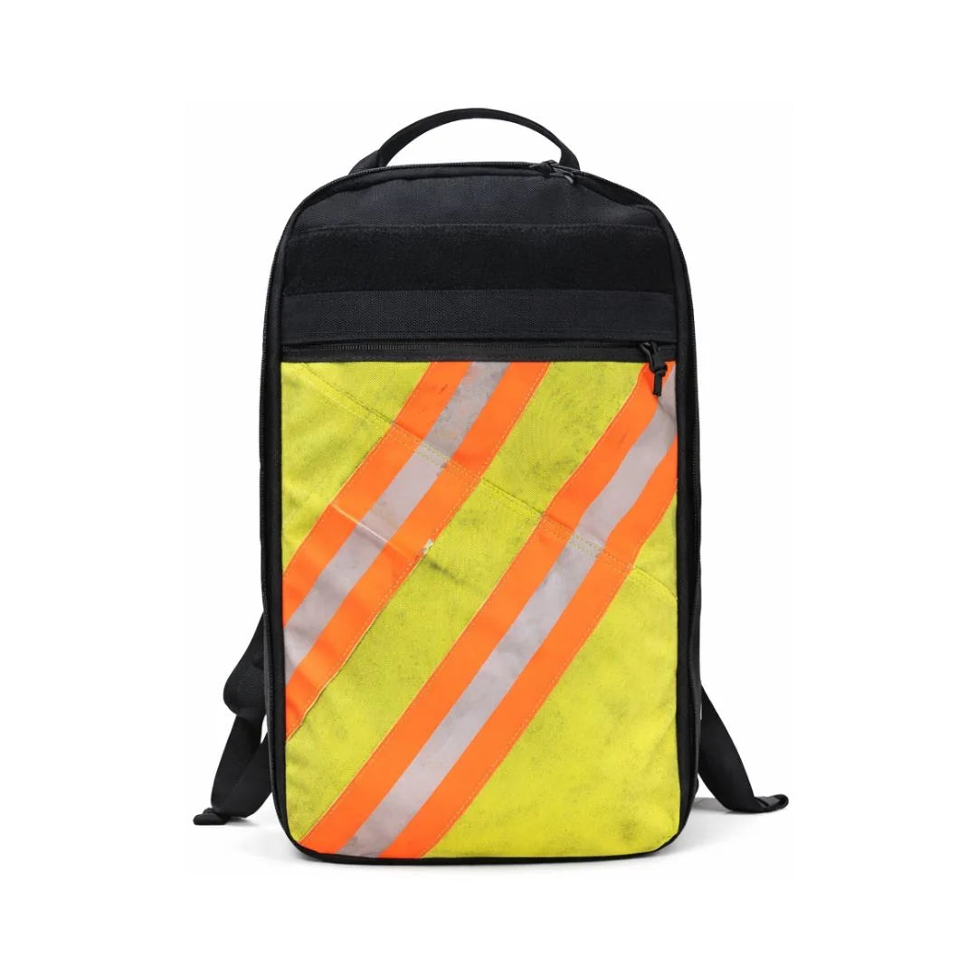The Chief USA-made tactical backpack by Recycled Firefighter with a repurposed firefighter gear panel and reflective orange safety stripe.