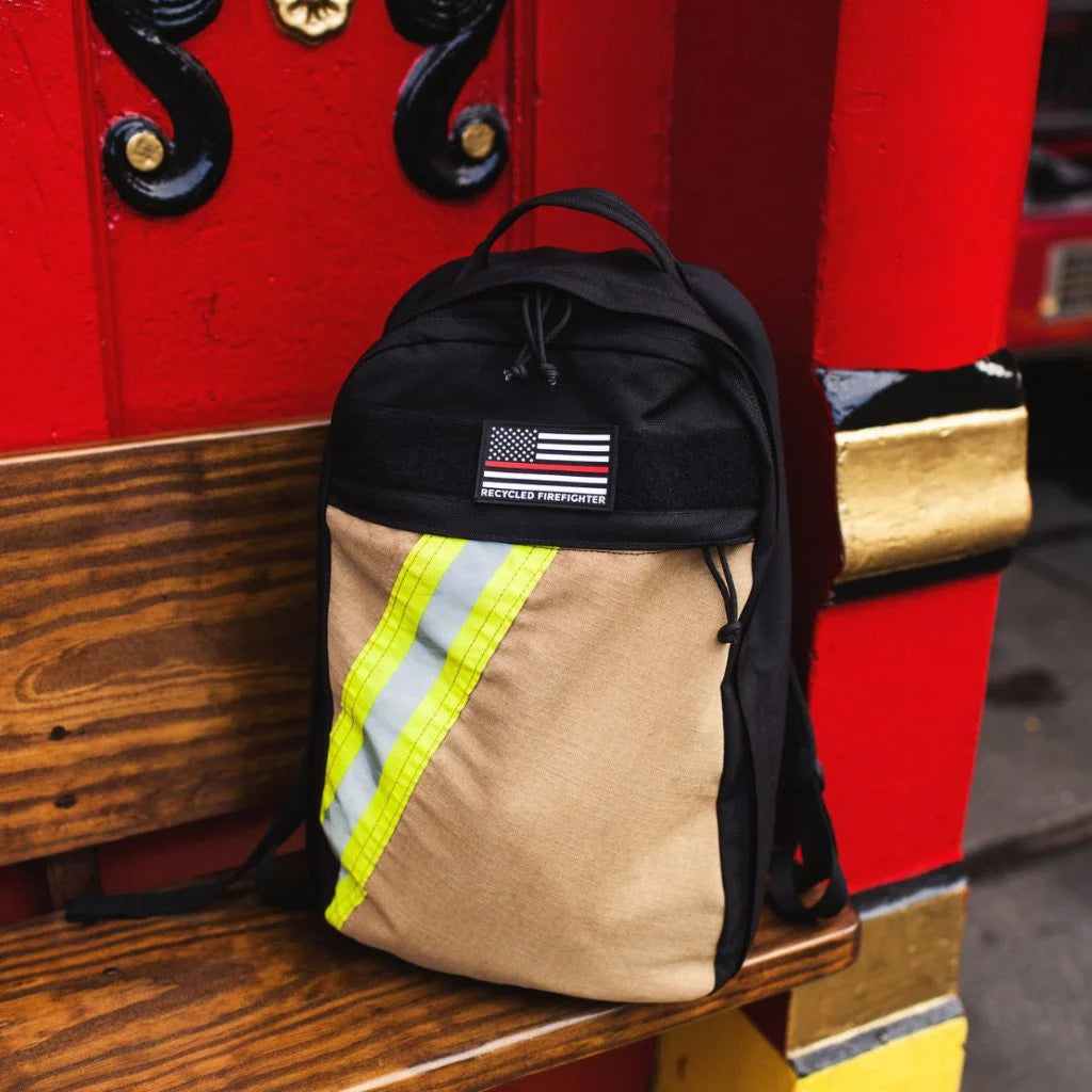 The Chief USA-made tactical backpack by Recycled Firefighter featuring a high-visibility yellow repurposed firefighter bunker gear front panel.