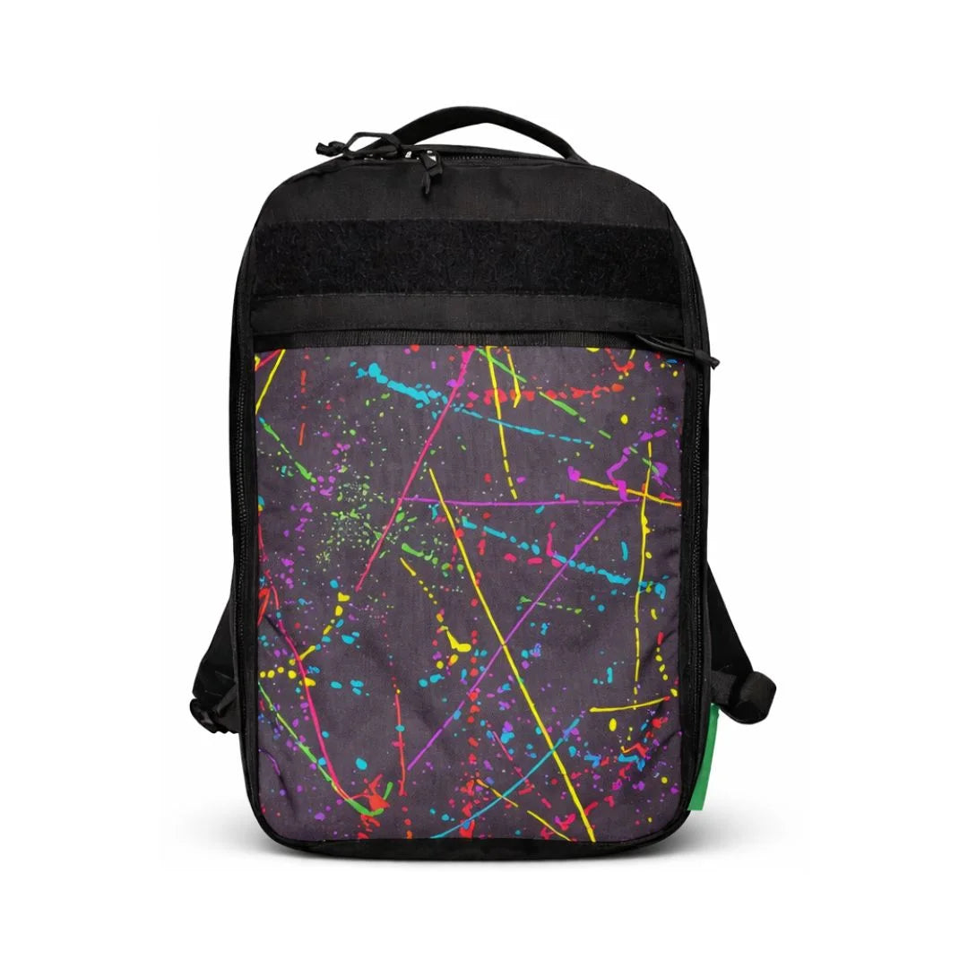 The Chief USA-made tactical backpack by Recycled Firefighter featuring a unique, artistic black and white splatter design.