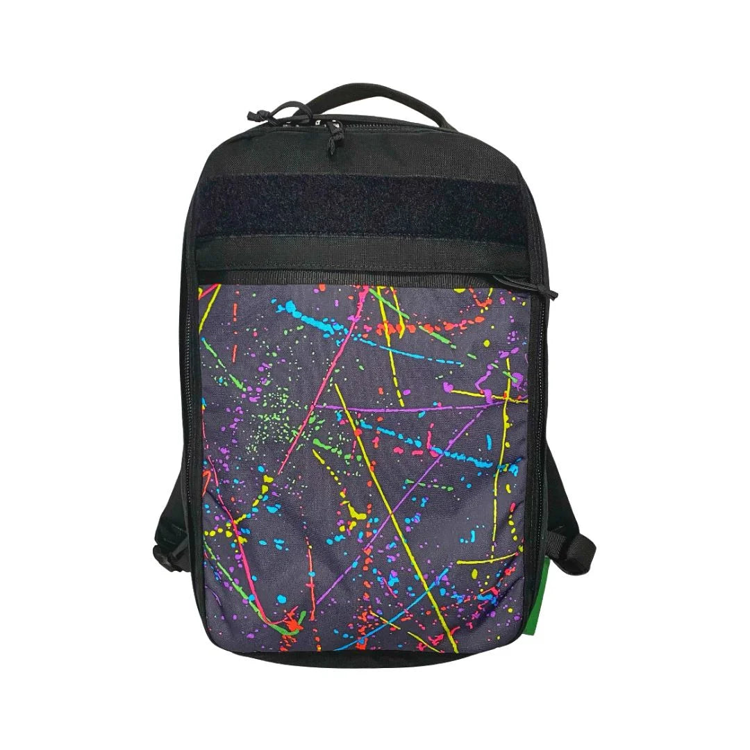 The Chief USA-made tactical backpack by Recycled Firefighter featuring a unique, artistic black and white splatter design.