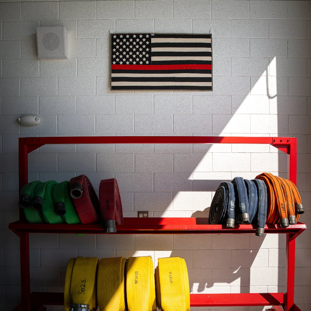 Professional-grade American Flag Fire Hose Thin Red Line in American Flag - Fire Hose - Thin Red Line from Recycled Firefighter. Quality tactical design for first responders.