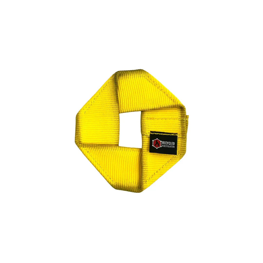The yellow Fire Hose Dog Frisbee JR. by Recycled Firefighter. Quality construction meets professional tactical requirements for demanding operations.