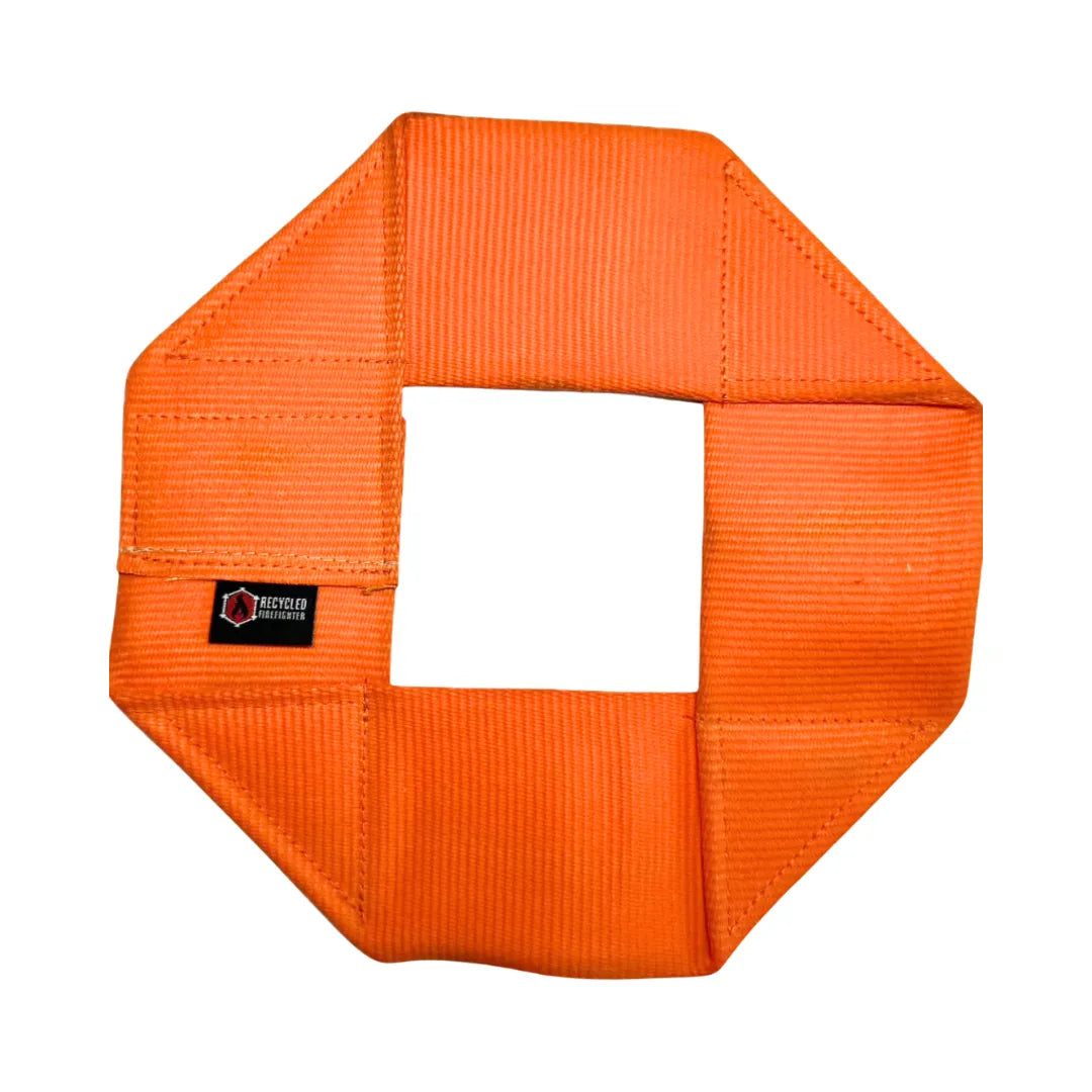 The Fire Hose Dog Frisbee in Orange by Recycled Firefighter. Tactical design meets professional durability standards.