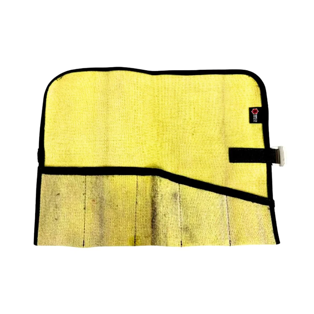 Vintage Yellow Fire Hose Tool Roll from Recycled Firefighter, showcasing the unique scuffs and character of real retired fire gear. This heavy-duty roll is box-stitched at all stress points to ensure a lifetime of reliable tool storage.