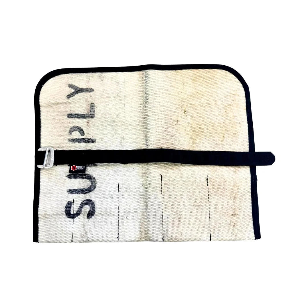 Recycled Firefighter Fire Hose Tool Roll in Vintage White, made from decommissioned double-jacketed fire hose. The design includes heavy-duty internal sleeves and a steel cinch buckle for professional tool organization.