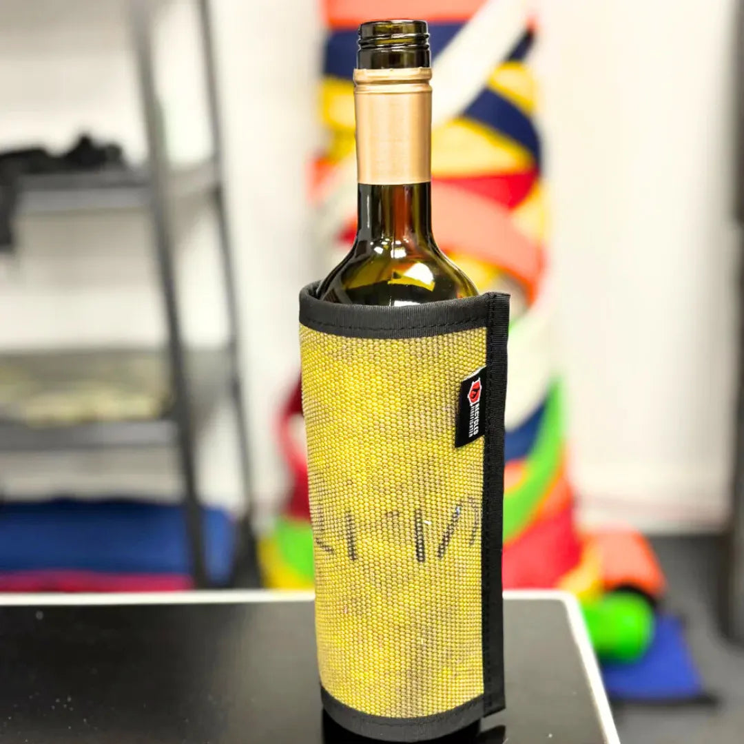 Recycled Firefighter's Vintage Yellow Firehose Wine Bottle Cover. Quality tactical gear built for demanding professional use.