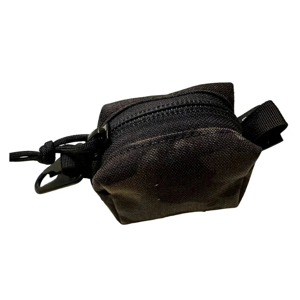 The Recycled Firefighter Hot Shot Keychain Pouch is a compact, USA-made tactical accessory featuring heavy-duty nylon, a secure zipper, and a metal clip for organizing small everyday essentials.