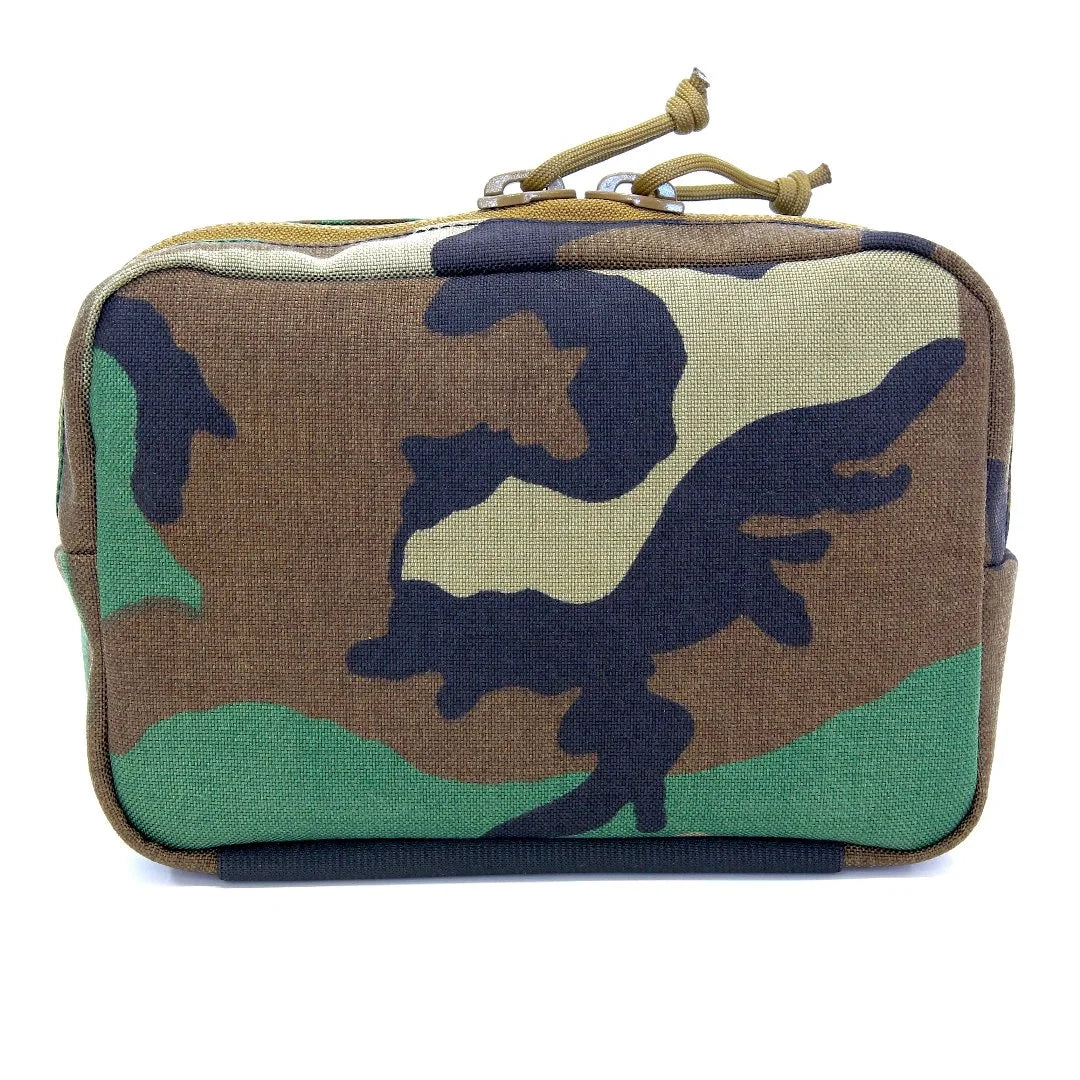 The Minimalist Woodland Fanny Pack in woodland from Recycled Firefighter. Professional-grade quality for everyday tactical use and operations.