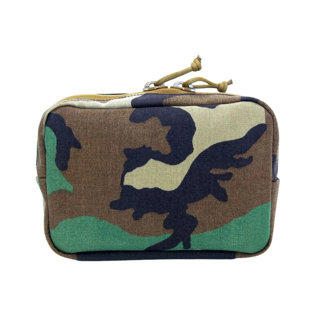 The Minimalist Woodland Fanny Pack in woodland from Recycled Firefighter. Professional-grade quality for everyday tactical use and operations.