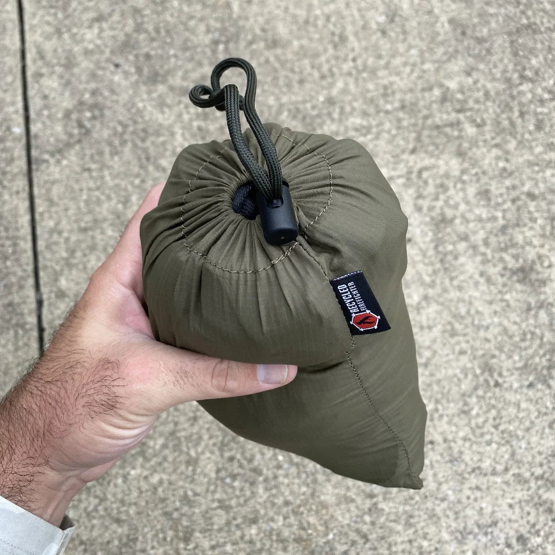 Recycled Firefighter Parachute Hammock featuring olive drab. Durable construction honors service with professional quality.