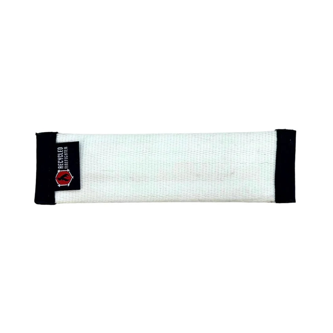 A durable JR-sized dog fetch toy by Recycled Firefighter made from repurposed white fire hose material with heavy-duty black stitched edging.