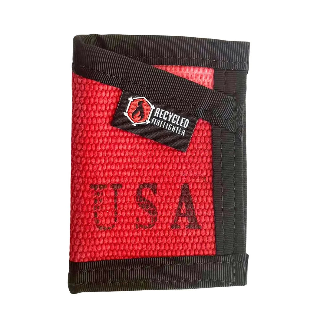 A vibrant Red Sergeant Wallet Firehose Edition by Recycled Firefighter accented with a durable black cash strap.