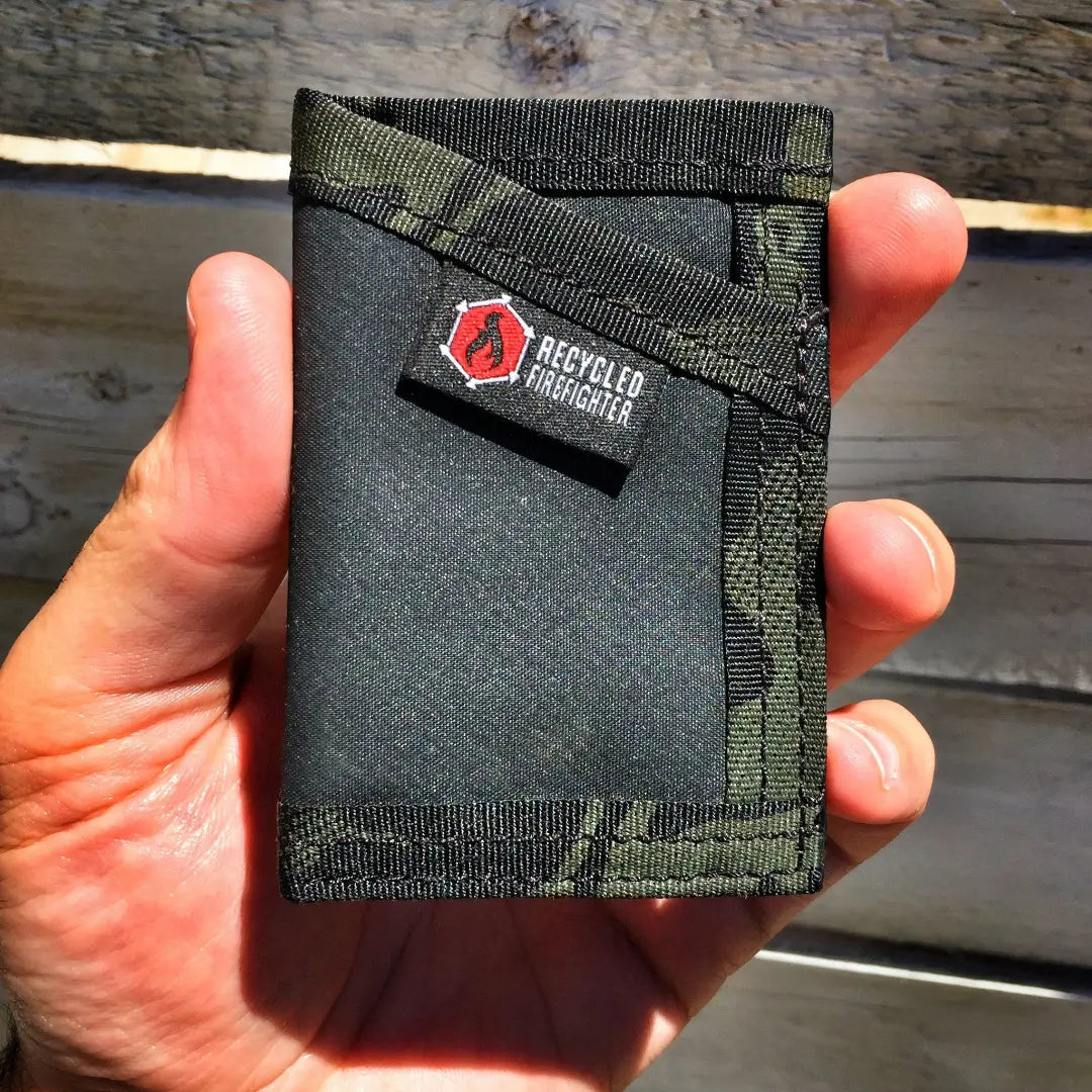 Black and multicam black Sergeant Hypalon Wallet from Recycled Firefighter. Water-resistant design maintains tactical appearance.
