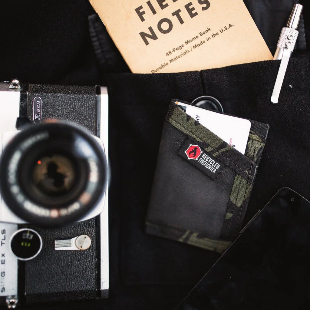 Black and multicam black Sergeant Hypalon Wallet from Recycled Firefighter. Water-resistant design maintains tactical appearance.