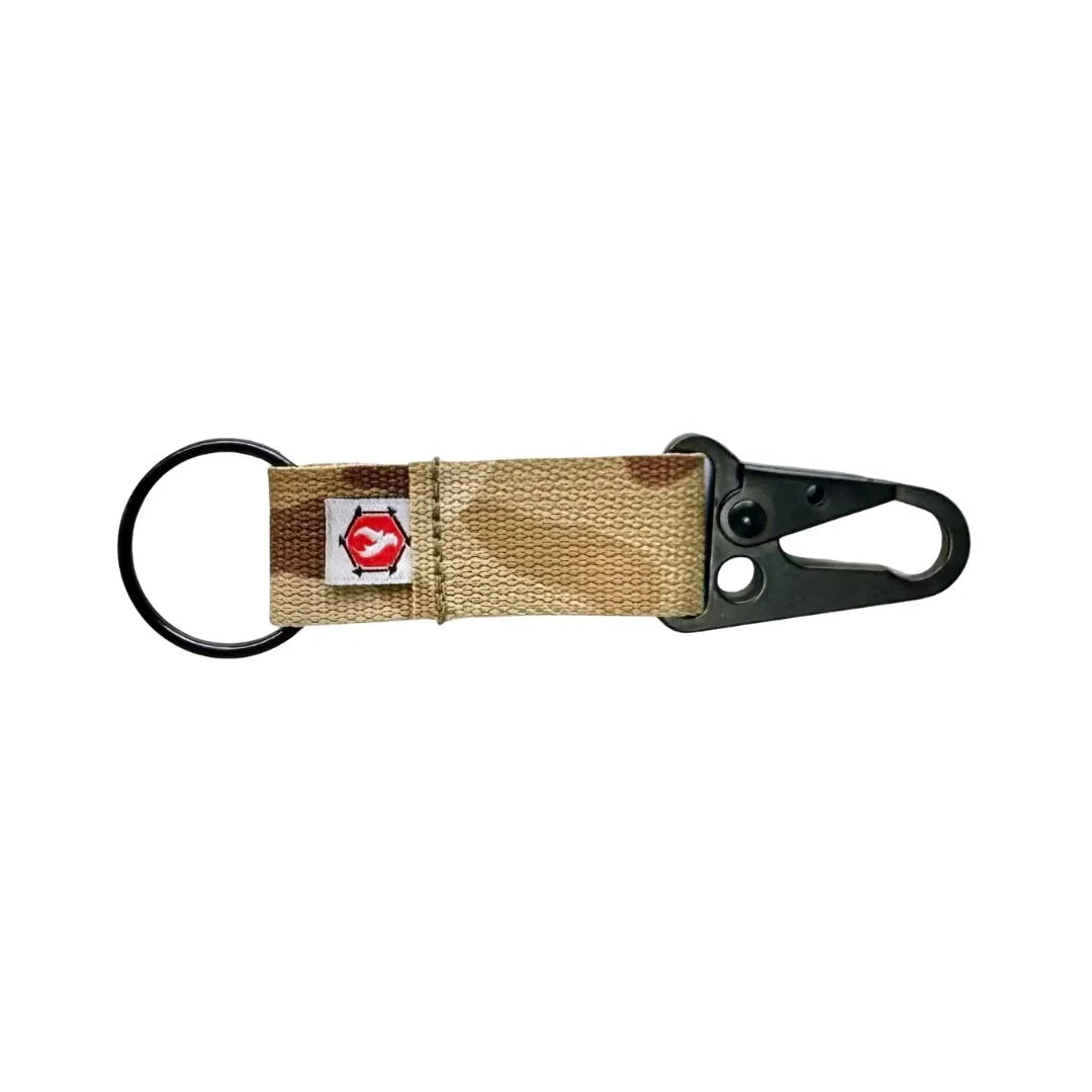 The The Chauffeur Durable keychain clip in Multicam Arid from Recycled Firefighter. Professional-grade quality for everyday tactical use and operations.