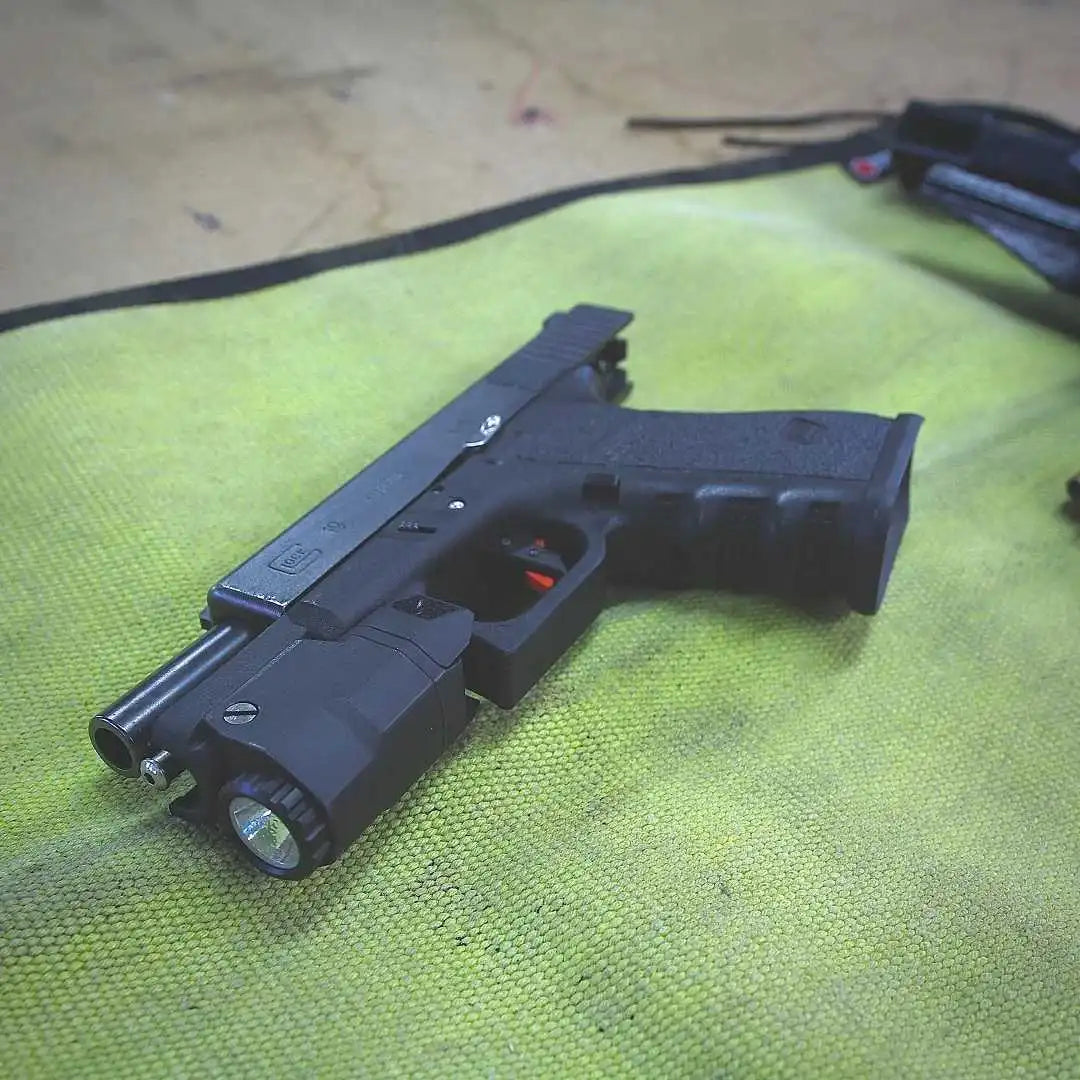 Yellow Black Variant A rugged Yellow Black Drop Zone Mat from Recycled Firefighter featuring a yellow repurposed firehose surface and black 1000D nylon backing. The mat is laid flat to provide a durable workspace for cleaning tools or organizing gear.