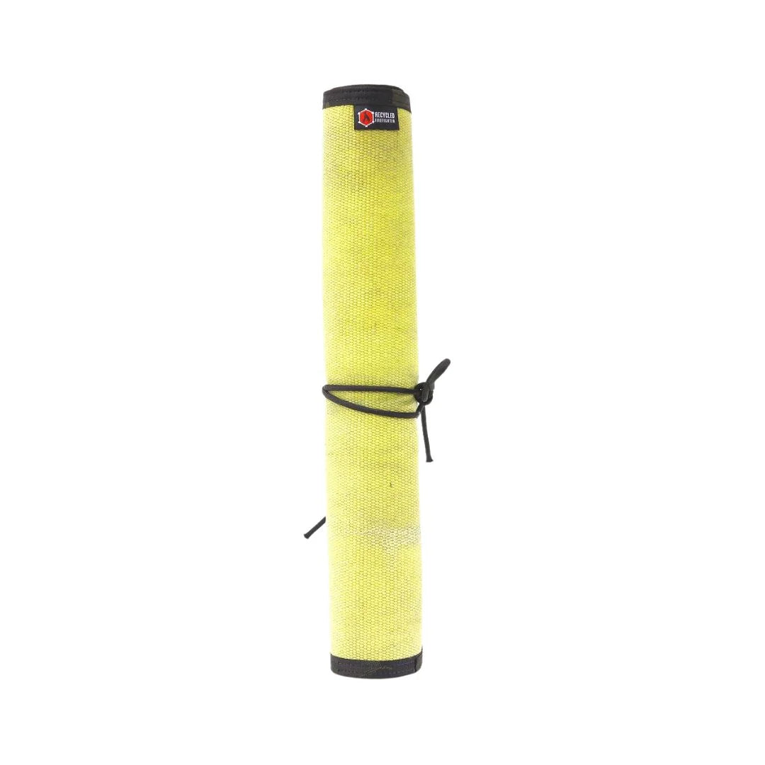 Yellow Black Variant A rugged Yellow Black Drop Zone Mat from Recycled Firefighter featuring a yellow repurposed firehose surface and black 1000D nylon backing. The mat is laid flat to provide a durable workspace for cleaning tools or organizing gear.