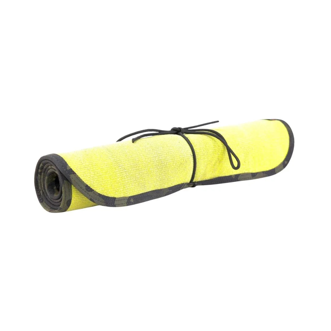 Yellow Black Variant A rugged Yellow Black Drop Zone Mat from Recycled Firefighter featuring a yellow repurposed firehose surface and black 1000D nylon backing. The mat is laid flat to provide a durable workspace for cleaning tools or organizing gear.