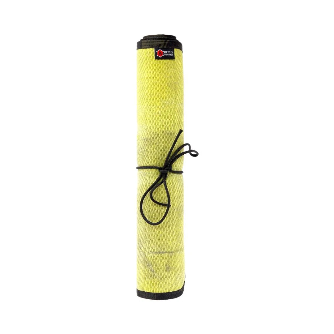 Yellow Black Variant A rugged Yellow Black Drop Zone Mat from Recycled Firefighter featuring a yellow repurposed firehose surface and black 1000D nylon backing. The mat is laid flat to provide a durable workspace for cleaning tools or organizing gear.