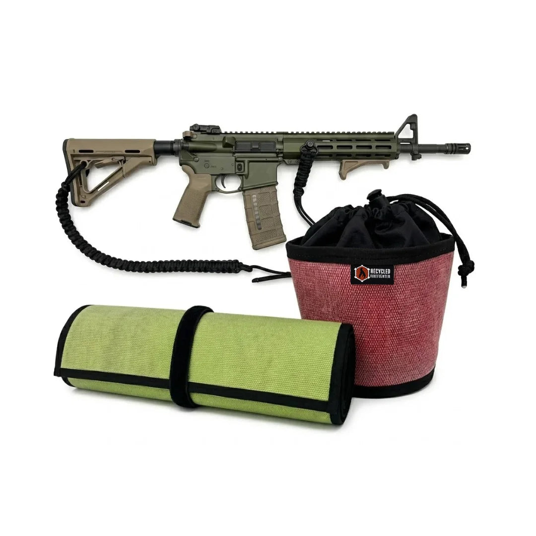 Recycled Firefighter Long Rifle Mat Firehose Edition in Vintage Green & Woodland displayed with a rifle and Ammo Gear Bag. Handmade in the USA from real fire hose for shooters who demand durable American-made range gear.