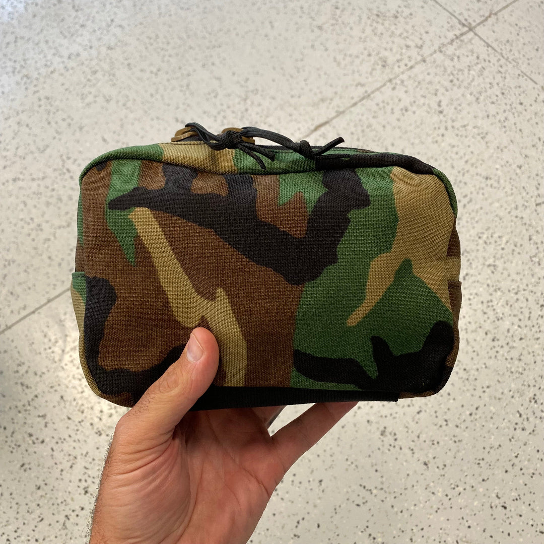 The Minimalist Woodland Fanny Pack in woodland from Recycled Firefighter. Professional-grade quality for everyday tactical use and operations.