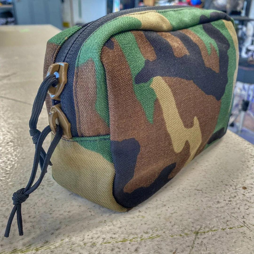 The Minimalist Woodland Fanny Pack in woodland from Recycled Firefighter. Professional-grade quality for everyday tactical use and operations.