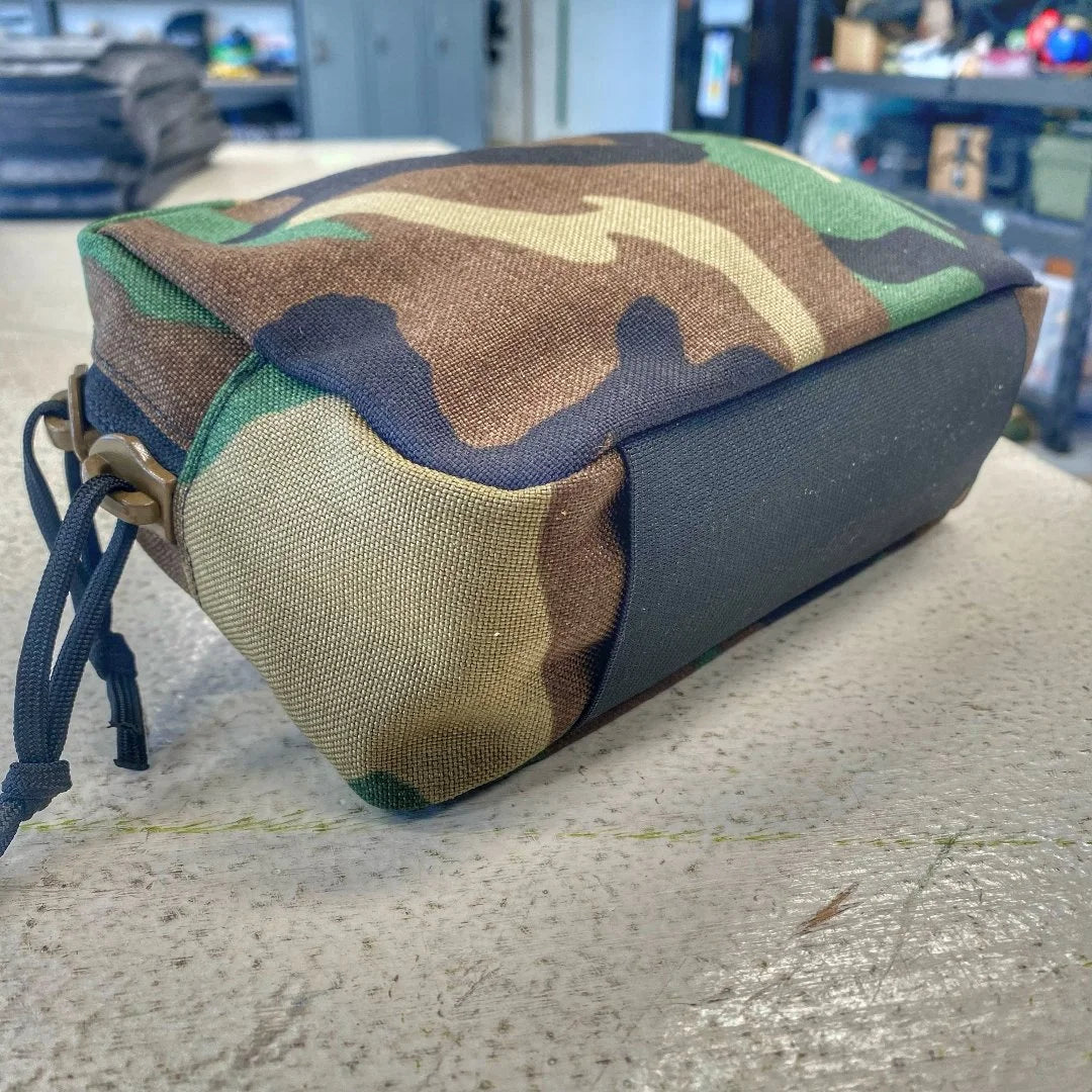 The Minimalist Woodland Fanny Pack in woodland from Recycled Firefighter. Professional-grade quality for everyday tactical use and operations.