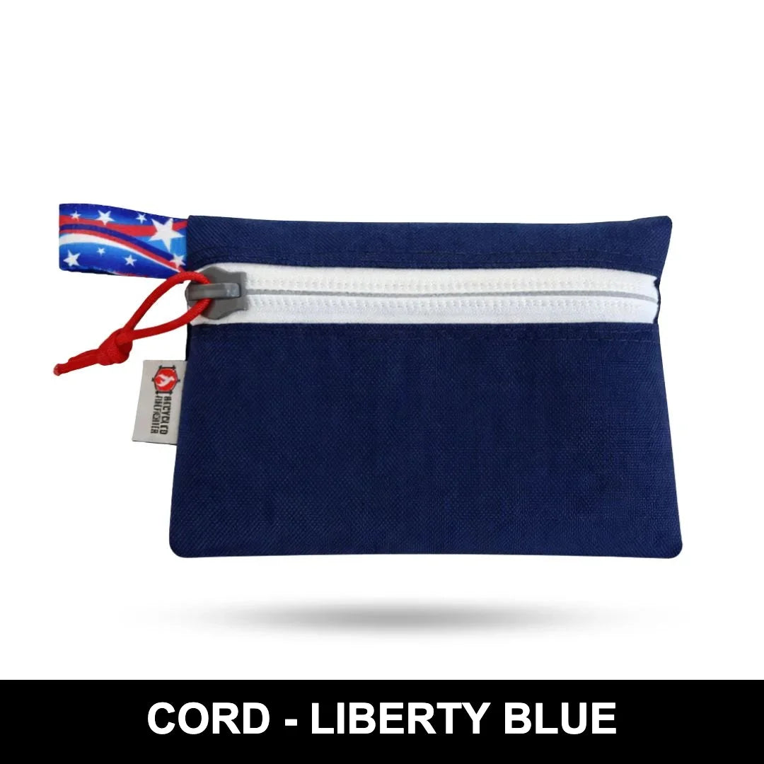 Cordura Liberty Blue Truckie Medium by Recycled Firefighter pouch built with durable fabric, a secure zipper, and compact storage for everyday carry essentials.