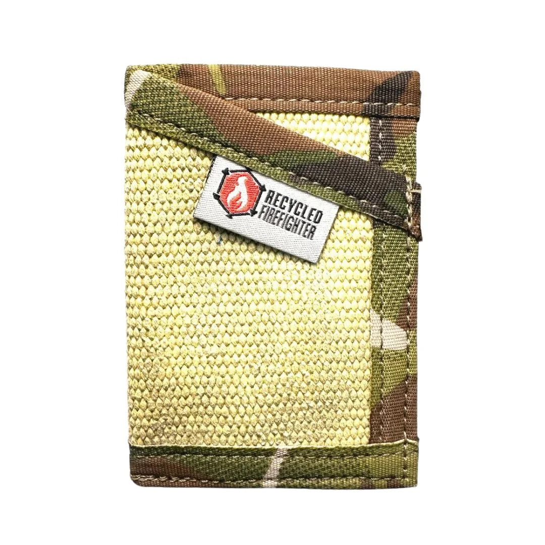 Vintage yellow meets multicam in this Sergeant Wallet by Recycled Firefighter. Fire hose construction creates durable tactical storage with distinctive color blocking.