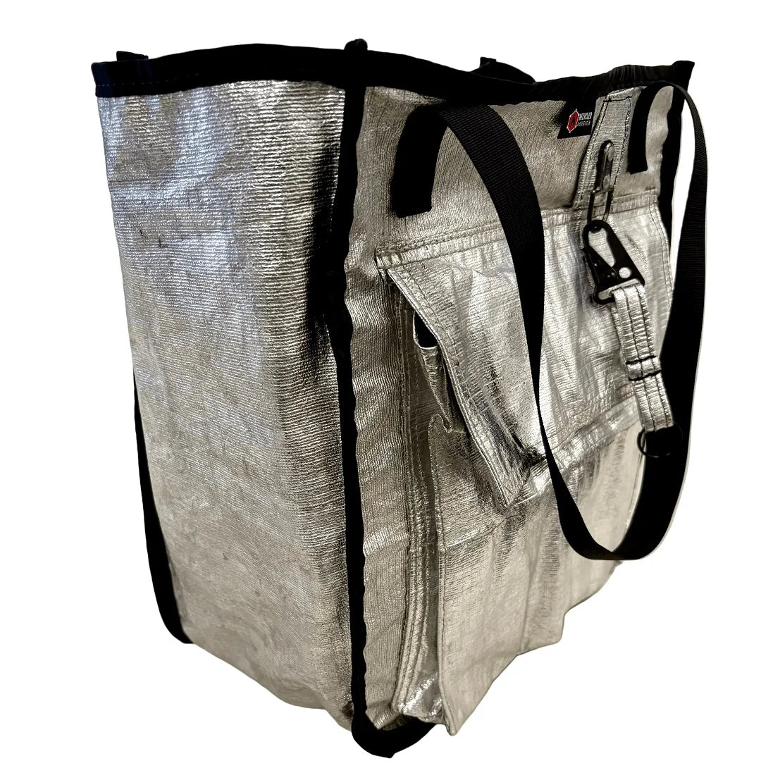 The Premier Tote Bag from Recycled Firefighter featuring Silver shield custom keychain. Durable gear designed for first responders and tactical professionals.
