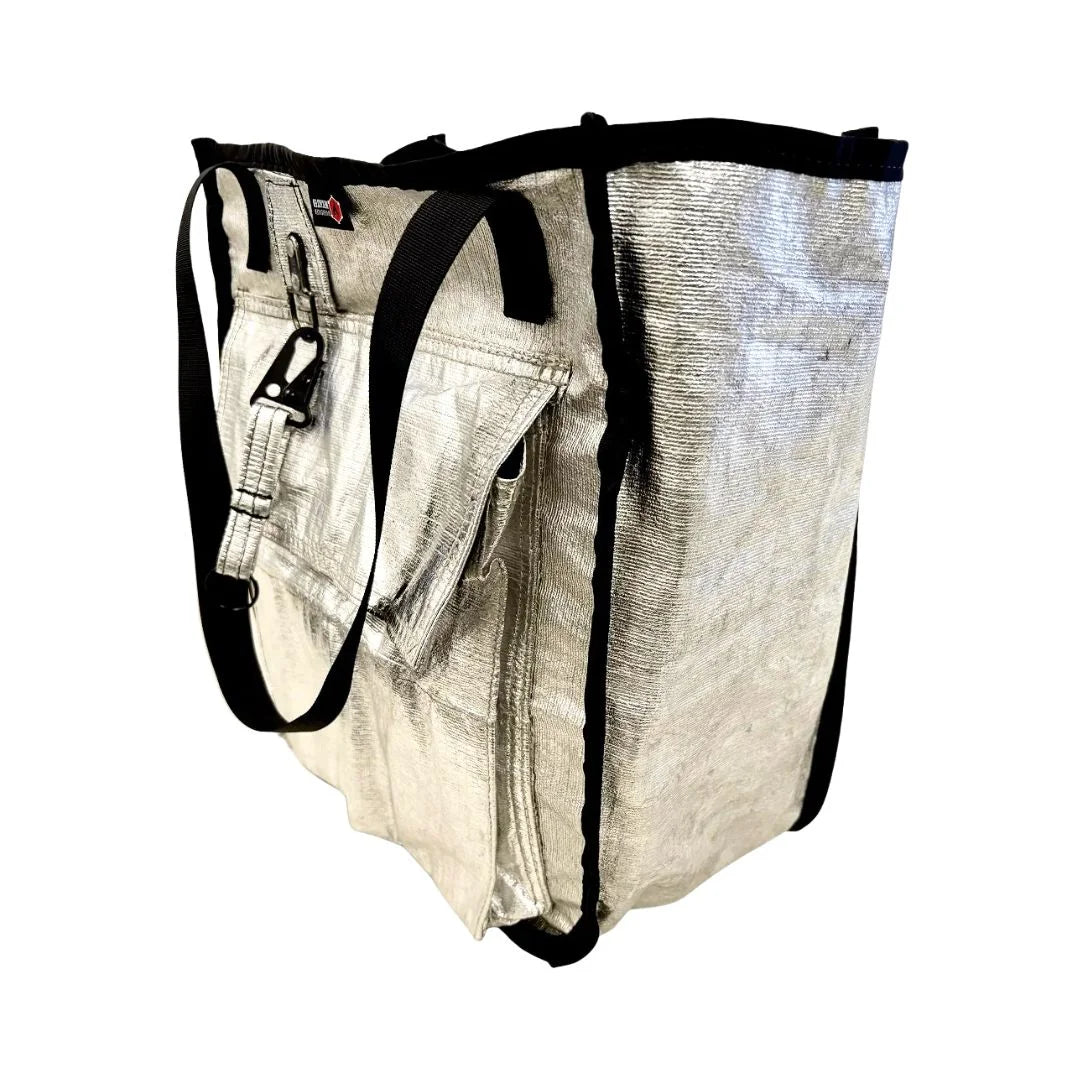 The Premier Tote Bag from Recycled Firefighter featuring Silver shield custom keychain. Durable gear designed for first responders and tactical professionals.