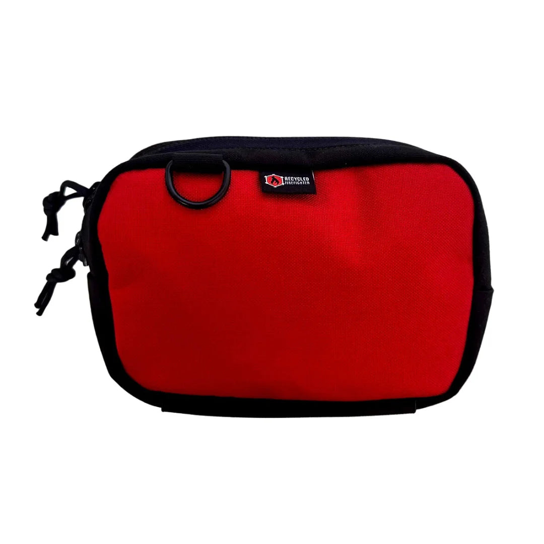 High-visibility red TrailHound Fanny Pack by Recycled Firefighter. Bold color ensures gear identification during emergency response.