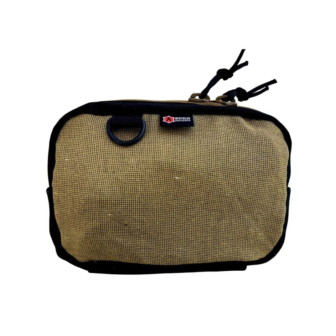 A minimalist tan bunker gear fanny pack from Recycled Firefighter made from authentic MSA-brand turnout gear. This variant features a clean, rugged brown canvas look without the reflective safety stripes, showcasing the raw material's durability.