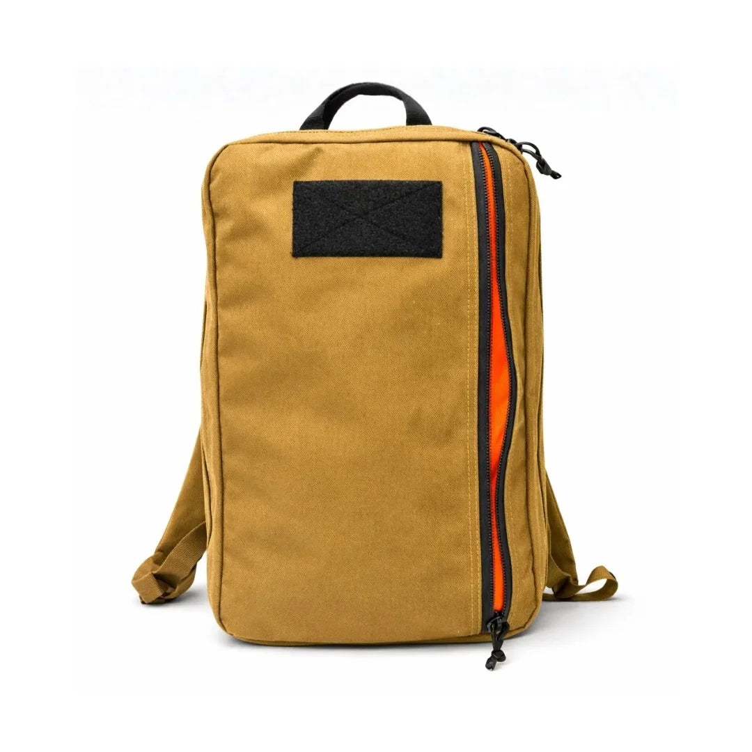 The Recycled Firefighter 24 Hour PLUS Backpack in Coyote brown offers a classic military-inspired aesthetic with a high-capacity 28-liter dual-clamshell design.