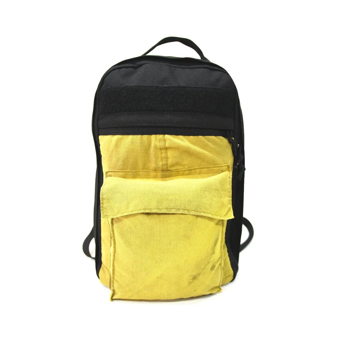 The Chief USA-made tactical backpack by Recycled Firefighter in tan featuring an integrated external front storage pocket.