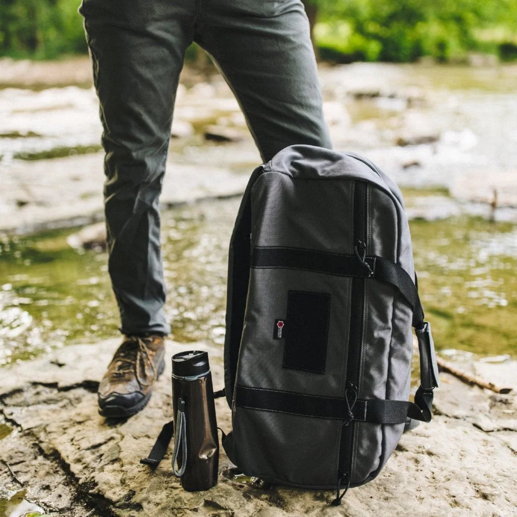A sleek Tactical Grey 72 Hour Duffle Backpack by Recycled Firefighter designed for durability and a professional aesthetic.