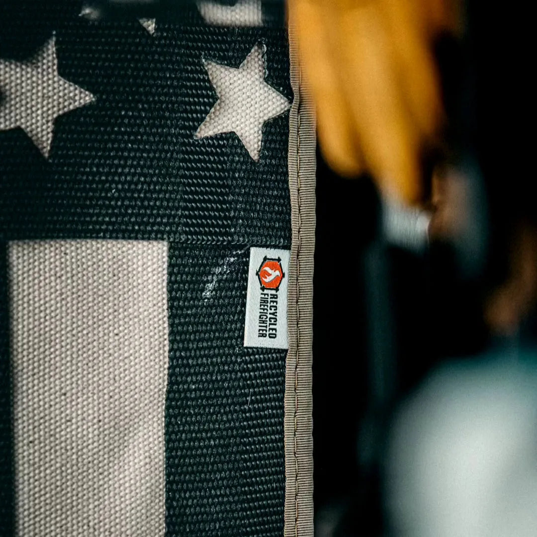 Professional-grade American Flag Fire Hose Thin Red Line in American Flag - Fire Hose - Thin Red Line from Recycled Firefighter. Quality tactical design for first responders.