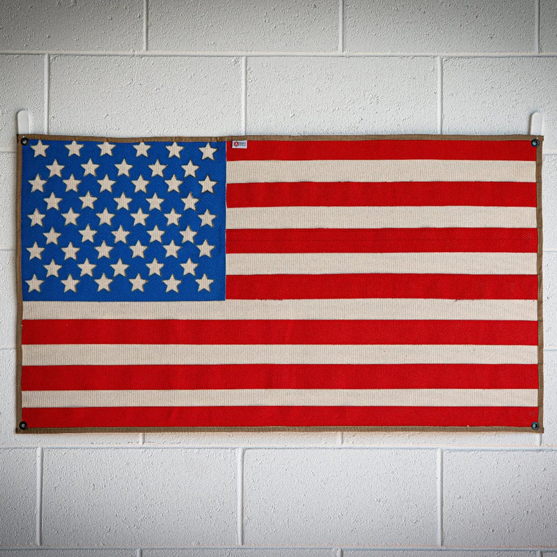 American Flag wall art from real decommissioned 5-inch fire hose with brass mounting grommets — USA made by Recycled Firefighter.