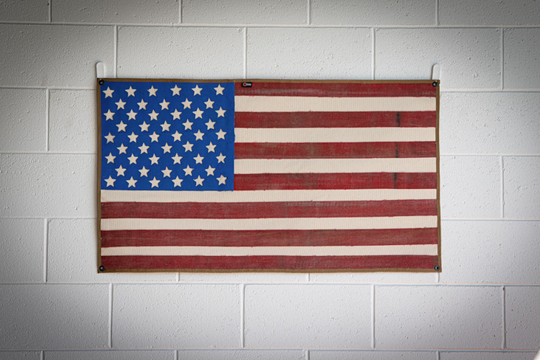 American Flag Fire Hose Vintage hanging on the bricks wall RecycledFirefighter