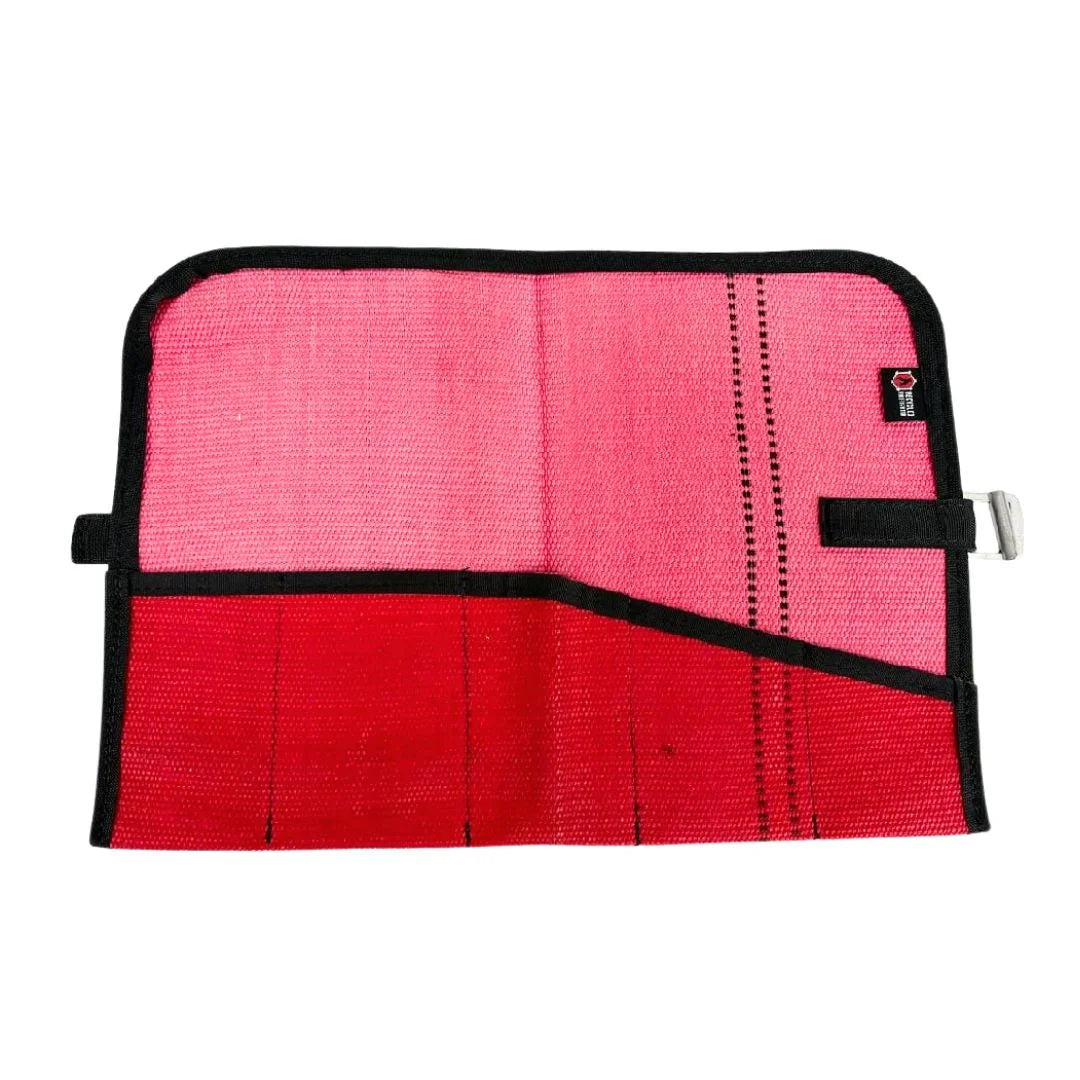 Red Fire Hose Tool Roll by Recycled Firefighter, repurposed from authentic high-performance fire hose. It features seven heavy-duty sleeves and mil-spec webbing to keep your essential hand tools organized and protected.