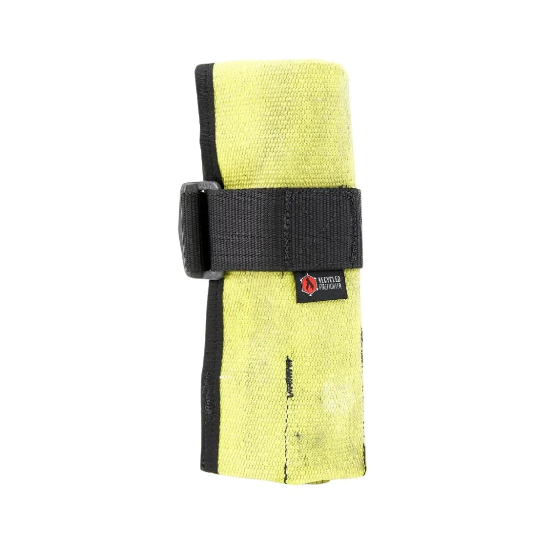 Vintage Yellow Fire Hose Tool Roll from Recycled Firefighter, showcasing the unique scuffs and character of real retired fire gear. This heavy-duty roll is box-stitched at all stress points to ensure a lifetime of reliable tool storage.