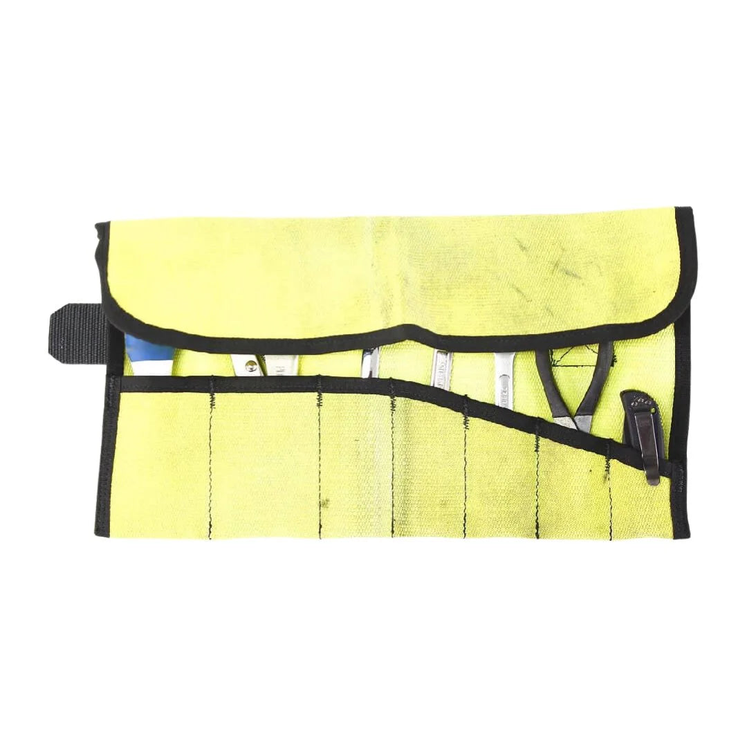 Vintage Yellow Fire Hose Tool Roll from Recycled Firefighter, showcasing the unique scuffs and character of real retired fire gear. This heavy-duty roll is box-stitched at all stress points to ensure a lifetime of reliable tool storage.