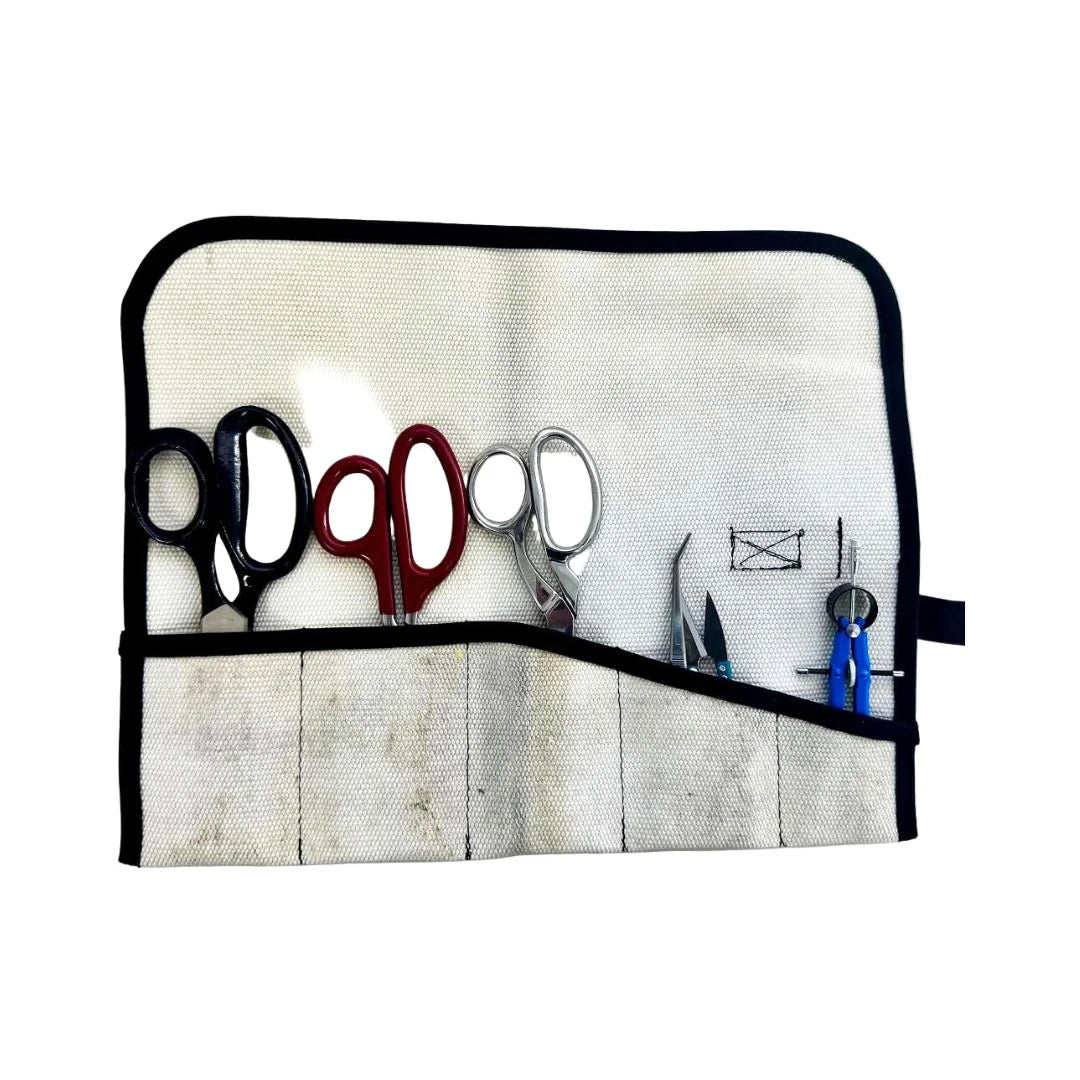 Recycled Firefighter Fire Hose Tool Roll in Vintage White, made from decommissioned double-jacketed fire hose. The design includes heavy-duty internal sleeves and a steel cinch buckle for professional tool organization.