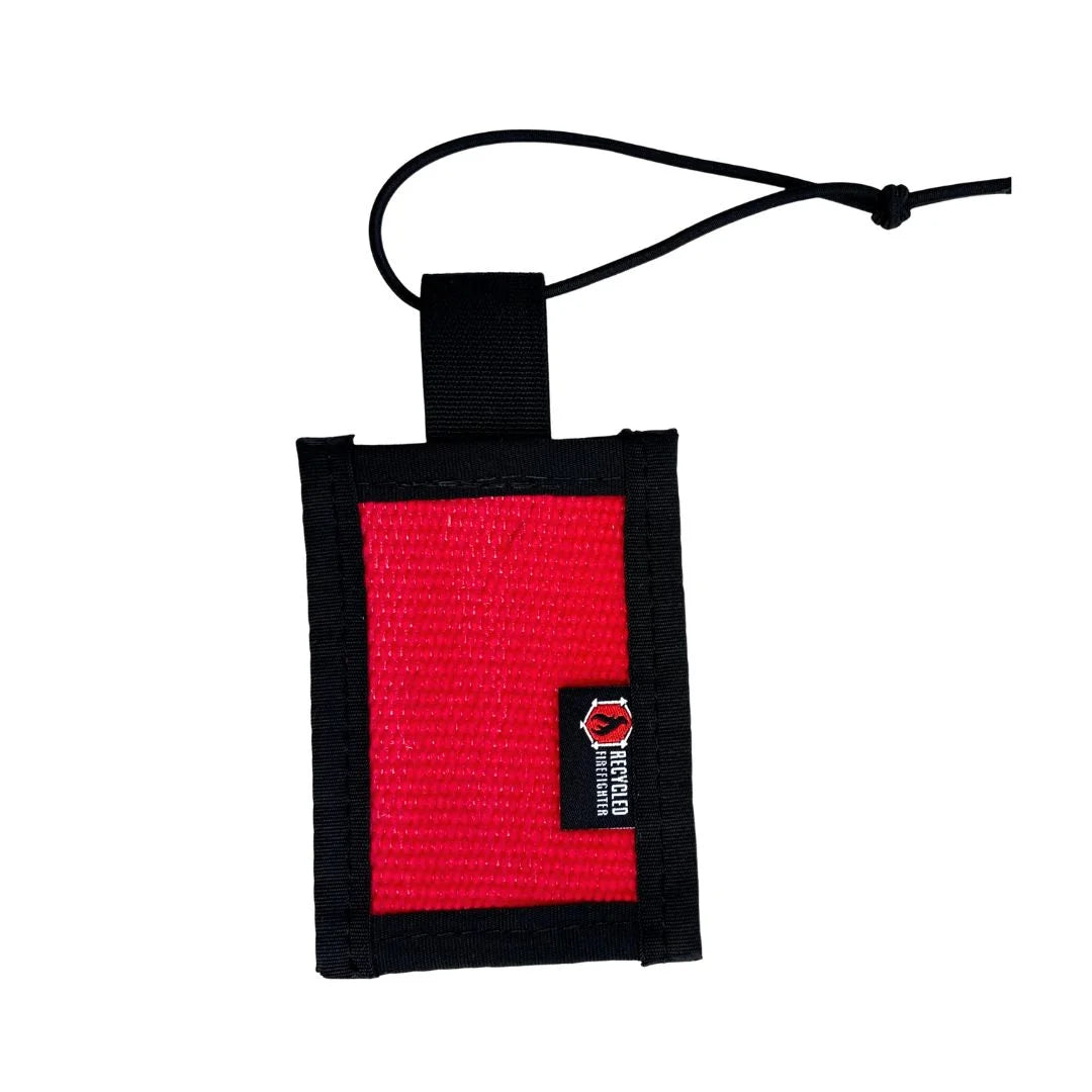 Red upcycled firehose luggage tag with clear ID window and black mil-spec binding by Recycled Firefighter.