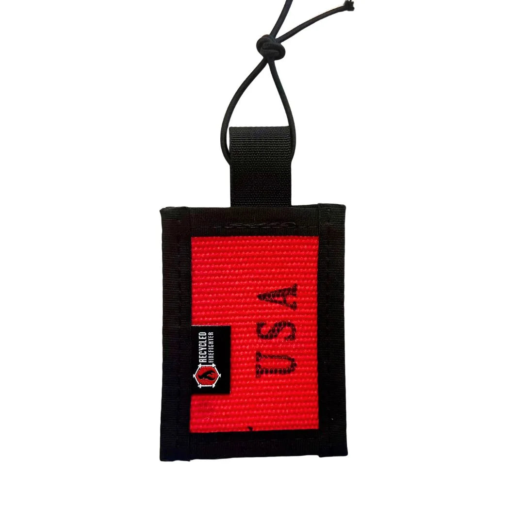 Red upcycled firehose luggage tag with clear ID window and black mil-spec binding by Recycled Firefighter.
