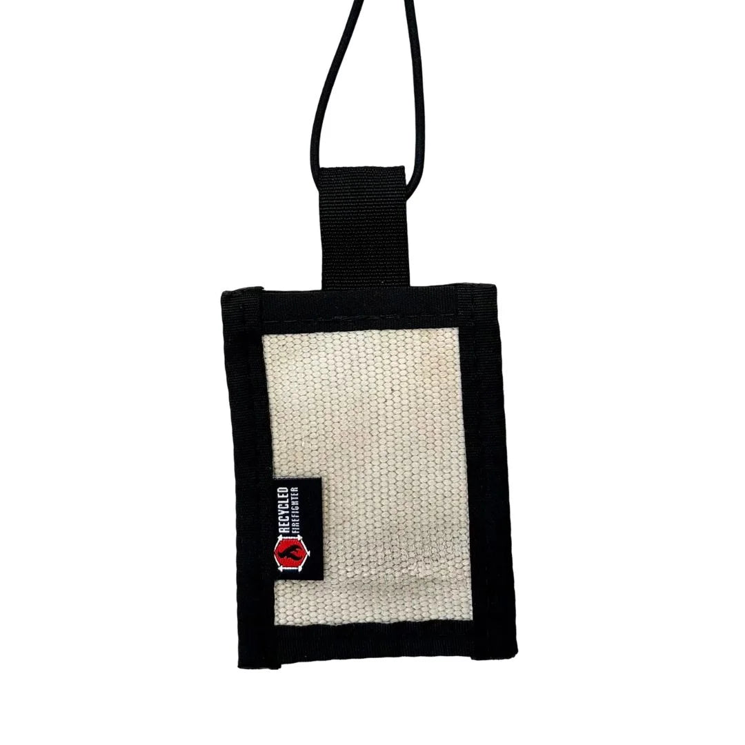 White decommissioned firehose luggage tag featuring durable nylon edges and elastic shock cord by Recycled Firefighter.