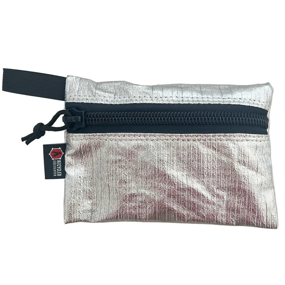 The Flat Zippered Gear Pouch Medium in vintage bunker gear - silver by Recycled Firefighter. Tactical design meets professional durability standards.